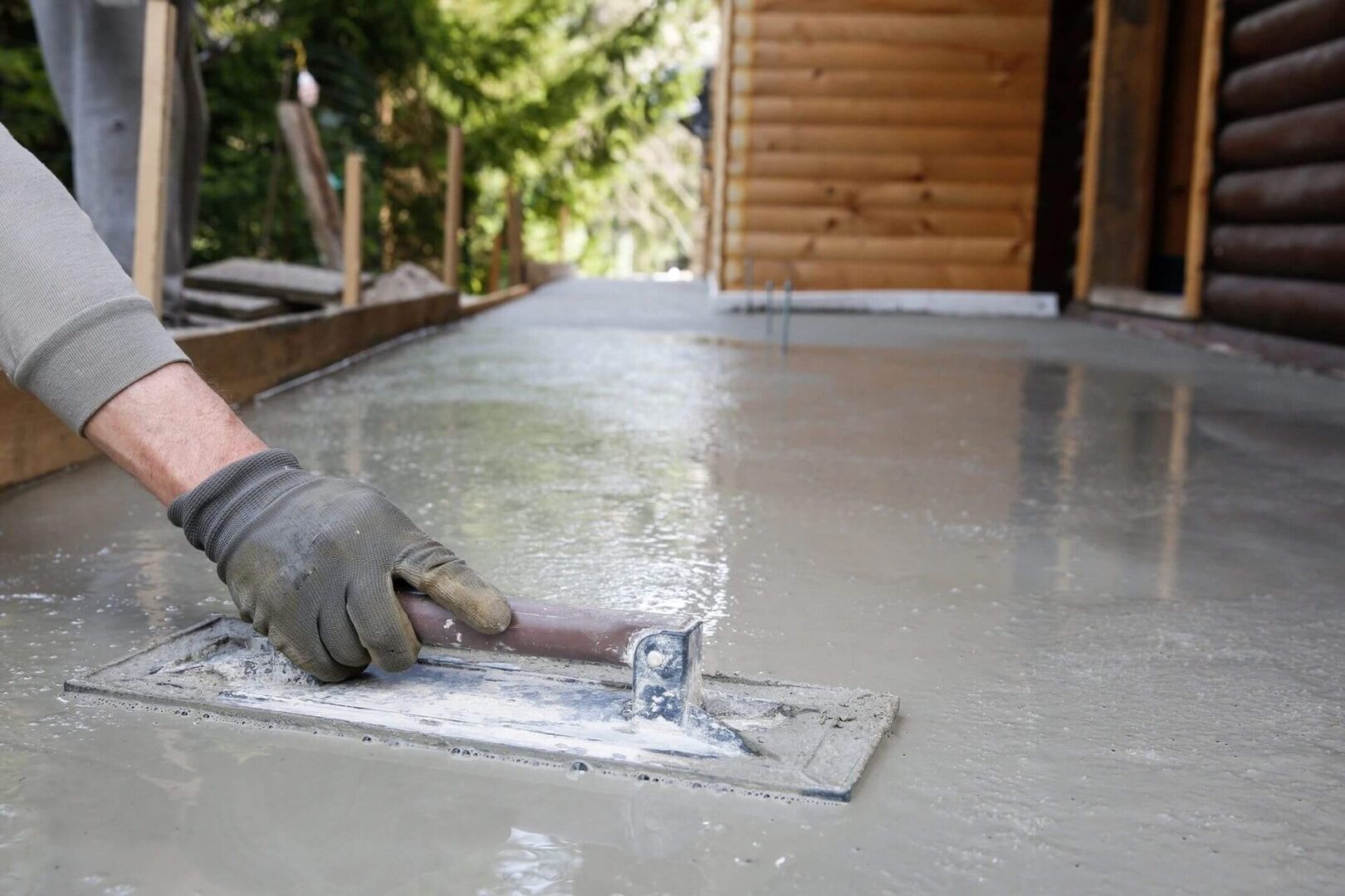 A person is working on the floor of a house.